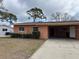 Lovely single-story home featuring a covered carport and well-maintained front yard at 4435 Huntington Ne St, St Petersburg, FL 33703
