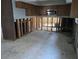 Awaiting renovation, the kitchen features exposed studs offering a view to the adjacent bathroom at 4706 Lansing Ne St, St Petersburg, FL 33703
