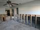 Living room exhibiting studs, ceiling fan and natural light awaiting renovation and new residents at 4706 Lansing Ne St, St Petersburg, FL 33703