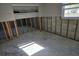 Spacious living room ready for renovation, featuring a ceiling fan and natural light at 4706 Lansing Ne St, St Petersburg, FL 33703