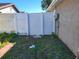 Fenced backyard shows a small, manageable space ready for landscaping and outdoor enjoyment at 6220 Keller Dr, Port Richey, FL 34668