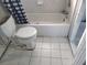 View of the bathroom shows a toilet and bathtub, ready for renovation and customization at 6220 Keller Dr, Port Richey, FL 34668