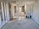 Demolition view of the living room shows access to other rooms and bathrooms, awaiting complete renovation at 6220 Keller Dr, Port Richey, FL 34668