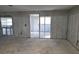 View of a Living Room with exposed framing ready for renovation and personalization at 6220 Keller Dr, Port Richey, FL 34668