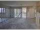 View of a Living Room with exposed framing ready for renovation and personalization at 6220 Keller Dr, Port Richey, FL 34668
