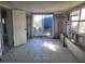 View of a Sun Room with exposed framing ready for renovation and personalization at 6220 Keller Dr, Port Richey, FL 34668