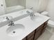 This bathroom features a double-sink vanity with a white countertop and a soaking tub at 6310 116Th E Ave, Parrish, FL 34219