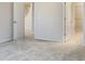This bedroom features carpeted floors and doors to a hallway and walk-in closet at 6310 116Th E Ave, Parrish, FL 34219