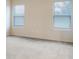 Cozy bedroom with soft carpeting and plenty of natural light streaming through the large windows at 6310 116Th E Ave, Parrish, FL 34219