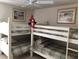 Cozy bedroom featuring bunk beds, charming artwork, and a playful touch with Spiderman at 6211 Timber Lake Dr # B4, Sarasota, FL 34243