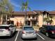 Exterior view of a multi-unit residential building with well-maintained landscaping and ample parking space at 6211 Timber Lake Dr # B4, Sarasota, FL 34243