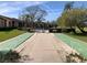 Community shuffleboard court surrounded by lush landscaping and green grass at 6211 Timber Lake Dr # B4, Sarasota, FL 34243