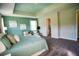 Inviting bedroom features a calming color scheme, lots of natural light, and ensuite bathroom at 9995 Dolphin Gull Cir, Thonotosassa, FL 33592