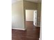 Bedroom highlighting neutral walls, wood floors, and natural light from a bright window at 2911 Bear Oak Dr, Valrico, FL 33594