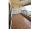 Tiled balcony featuring ceiling fan and view of neighboring building at 4780 Brittany S Dr # 111, St Petersburg, FL 33715