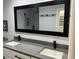 Bathroom features double sinks, granite countertop, and black hardware, blending style with modern practicality at 4780 Brittany S Dr # 111, St Petersburg, FL 33715