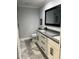 Bathroom features double sinks, granite countertop, and black hardware, blending style with modern practicality at 4780 Brittany S Dr # 111, St Petersburg, FL 33715
