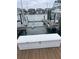 Dock featuring a white storage box, providing convenient and secure storage for boating equipment at 4780 Brittany S Dr # 111, St Petersburg, FL 33715