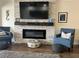 Bright living room featuring an electric fireplace, a large television, and comfortable seating area at 4780 Brittany S Dr # 111, St Petersburg, FL 33715
