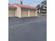 Attached garages with tan doors under a terracotta-colored roof at 4780 Brittany S Dr # 111, St Petersburg, FL 33715