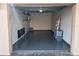 Interior garage with epoxy flooring, shelves, ladder, and storage containers at 4780 Brittany S Dr # 111, St Petersburg, FL 33715