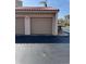 Attached garages with tan doors under a terracotta-colored roof at 4780 Brittany S Dr # 111, St Petersburg, FL 33715