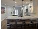 Bright kitchen featuring a large island, modern lighting fixtures, and stainless steel appliances at 4780 Brittany S Dr # 111, St Petersburg, FL 33715