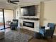 Bright living room featuring an electric fireplace, a large television, and comfortable seating area at 4780 Brittany S Dr # 111, St Petersburg, FL 33715