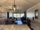 A combined living room and dining room with access to a patio and lots of natural light at 4780 Brittany S Dr # 111, St Petersburg, FL 33715