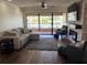 Comfortable living room features a stylish sectional sofa and a cozy fireplace with stone surround at 4780 Brittany S Dr # 111, St Petersburg, FL 33715