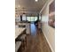 A contemporary kitchen and living room with a stone fireplace and a great view of the outdoors at 4780 Brittany S Dr # 111, St Petersburg, FL 33715