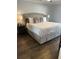 Comfortable main bedroom boasts plush bedding and stylish furnishings, creating a relaxing retreat at 4780 Brittany S Dr # 111, St Petersburg, FL 33715