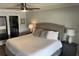 Spacious main bedroom featuring a ceiling fan and an en suite bathroom entry at 4780 Brittany S Dr # 111, St Petersburg, FL 33715