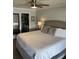Spacious main bedroom featuring a ceiling fan and an en suite bathroom entry at 4780 Brittany S Dr # 111, St Petersburg, FL 33715