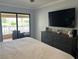 Bright main bedroom featuring a ceiling fan and a sliding glass door that leads to a private patio at 4780 Brittany S Dr # 111, St Petersburg, FL 33715