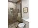 Updated shower with tile surround, niche, and glass door at 4780 Brittany S Dr # 111, St Petersburg, FL 33715