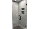 The shower features stylish marble tile and built-in niches for storage at 4780 Brittany S Dr # 111, St Petersburg, FL 33715