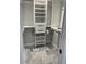Walk-in closet with built-in shelving providing ample storage at 4780 Brittany S Dr # 111, St Petersburg, FL 33715