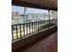 Balcony with a railing overlooks waterway with boats, docks, and waterfront homes at 4780 Brittany S Dr # 111, St Petersburg, FL 33715