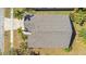 Overhead shot of the house roof, driveway, and yard showcasing the property's layout and landscaping at 7622 Hampshire Garden Pl, Apollo Beach, FL 33572