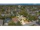 Aerial perspective of home in residential area showcasing the neighborhood's layout, landscaping, and proximity to other homes at 7622 Hampshire Garden Pl, Apollo Beach, FL 33572