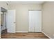 Bedroom featuring a closet with sliding doors and wood-look flooring at 1542 39 S St, St Petersburg, FL 33711