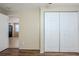 Bedroom view featuring hardwood floors and a closet with bi-fold doors at 1542 39 S St, St Petersburg, FL 33711
