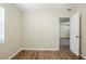 Bedroom featuring wood-look flooring and a window at 1542 39 S St, St Petersburg, FL 33711
