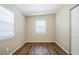 Bedroom showcasing hardwood flooring and neutral-painted walls at 1542 39 S St, St Petersburg, FL 33711