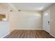 Neutral living room with new laminate floors and white front door at 1542 39 S St, St Petersburg, FL 33711