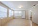 Neutral living room with tile floors and large windows at 1542 39 S St, St Petersburg, FL 33711