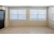 Neutral living room with tile floors and white paneling at 1542 39 S St, St Petersburg, FL 33711