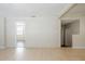 Neutral living room with tile floors and paneled walls at 1542 39 S St, St Petersburg, FL 33711