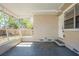 Enclosed porch with access door leading to a cozy backyard space at 1542 39 S St, St Petersburg, FL 33711